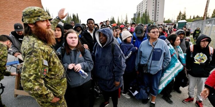 Canadians Evacuate Their Homes As Intense Fire Approaches Town